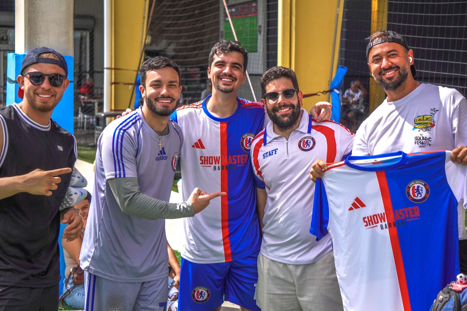 Chelsicha FC players and staff celebrating together
